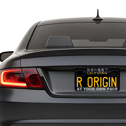 At Your Own Pace ABS Black Plastic Kanji Japanese License Plate Frame installed on car - Silver Text